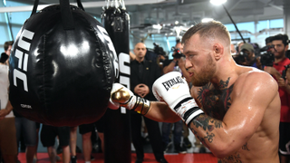 Here's Conor McGregor Knocking Down A Slice Of Pizza Wearing A Wig